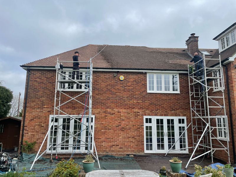 Roof cleaning carried out safely from scaffold towers by The Roof Moss Cleaners in Hedge End